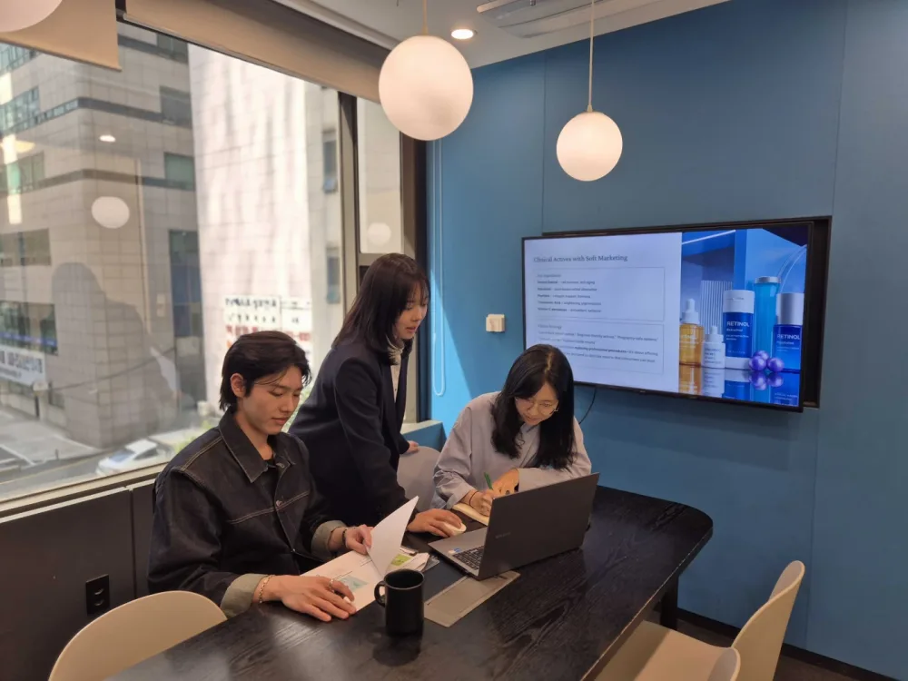 Crescent Seoul PM office team reviewing a brief